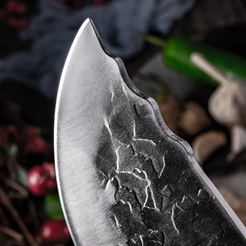 Hand forged stainless steel butcher knife with chicken wing wood handle and copper nails on a cutting board