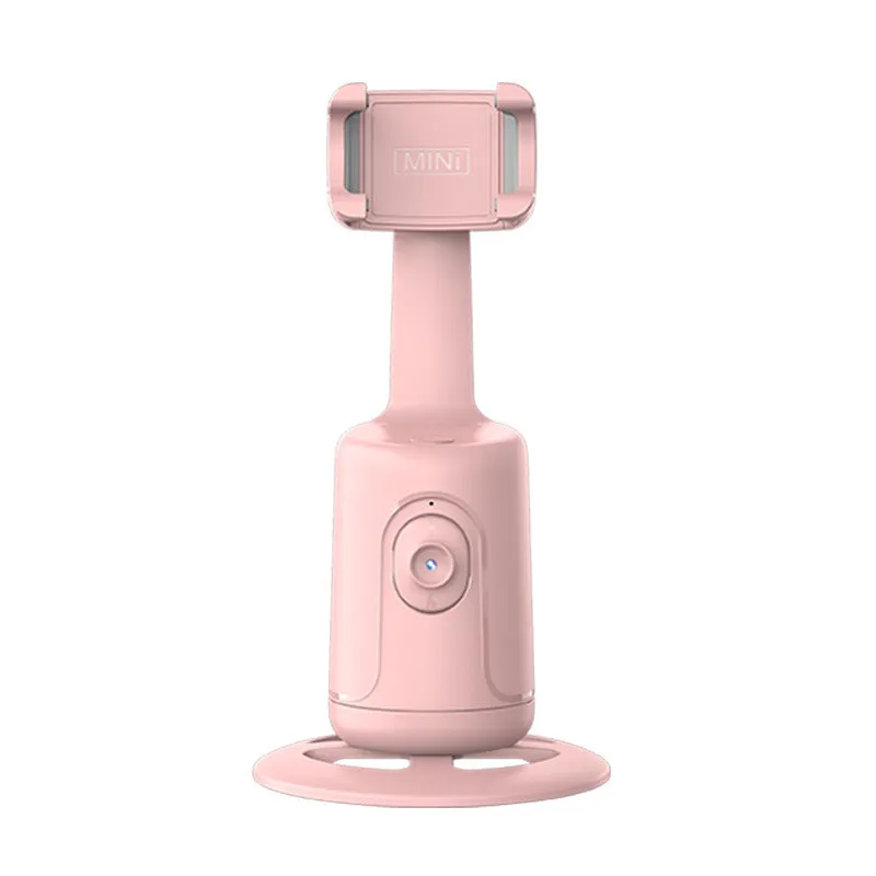 Automatic tracking stabiliser with 360-degree rotation in black, pink, and white on a desktop