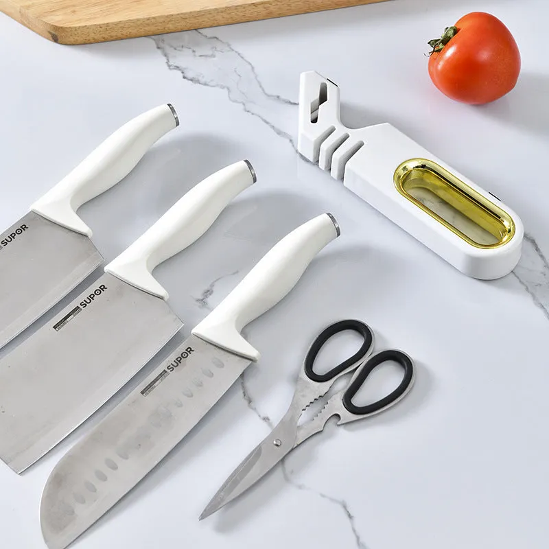 Four-in-one stone manual grinder for sharpening kitchen knives in pearl white colour, with ceramic and diamond stages visible