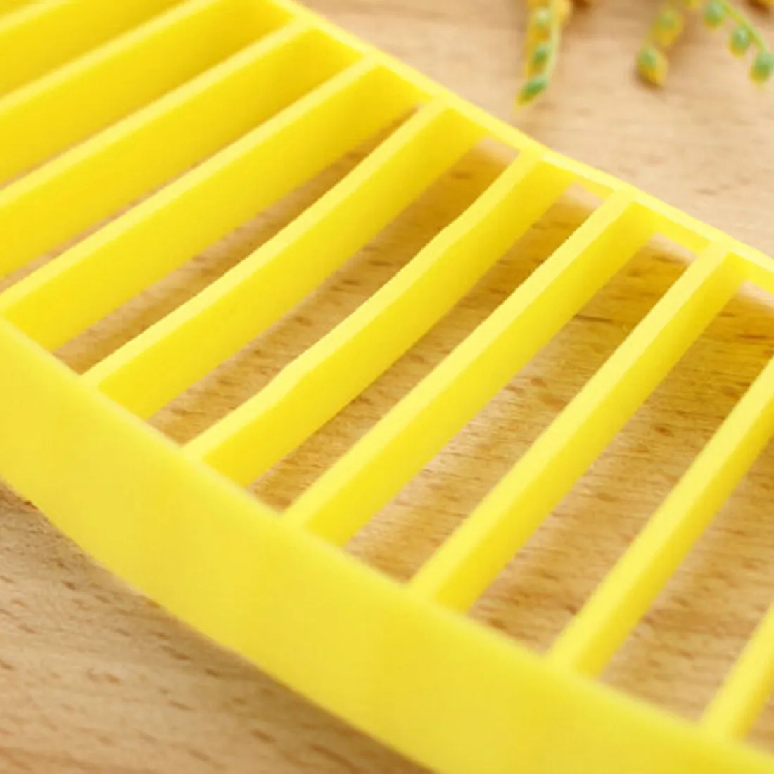 Yellow food grade PP banana slicer measuring approx 25 x 7 x 1.4 cm