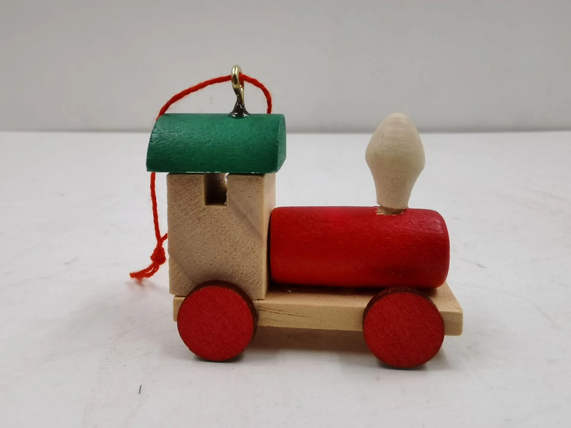 Handcrafted wooden Christmas train ornament in modern simple cartoon style, available in multiple colours