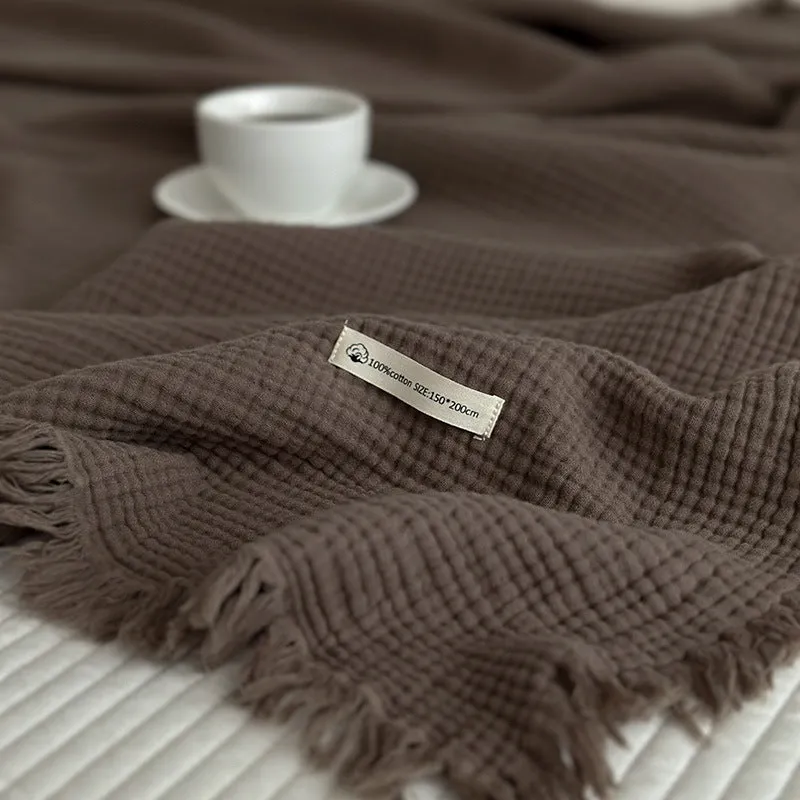 Four-layer cotton gauze blanket with tassel trim in navy blue colour