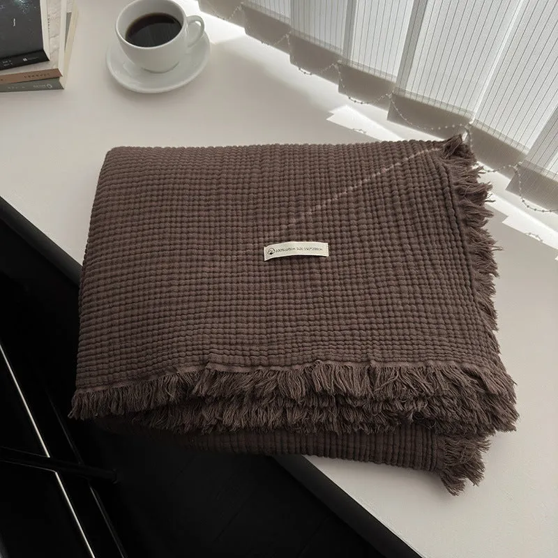 Four-layer cotton gauze blanket with tassel trim in navy blue colour