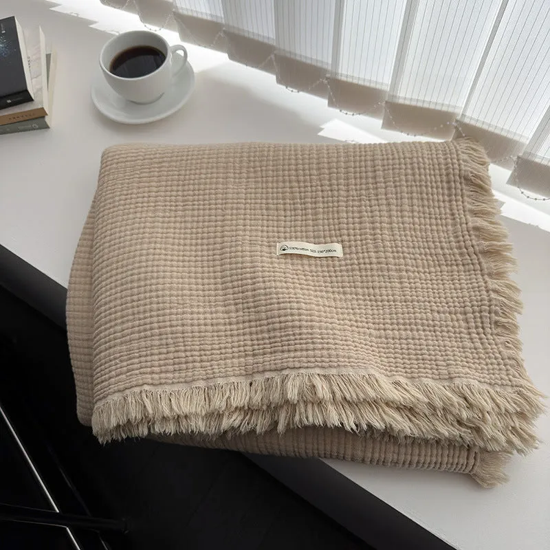 Four-layer cotton gauze blanket with tassel trim in navy blue colour