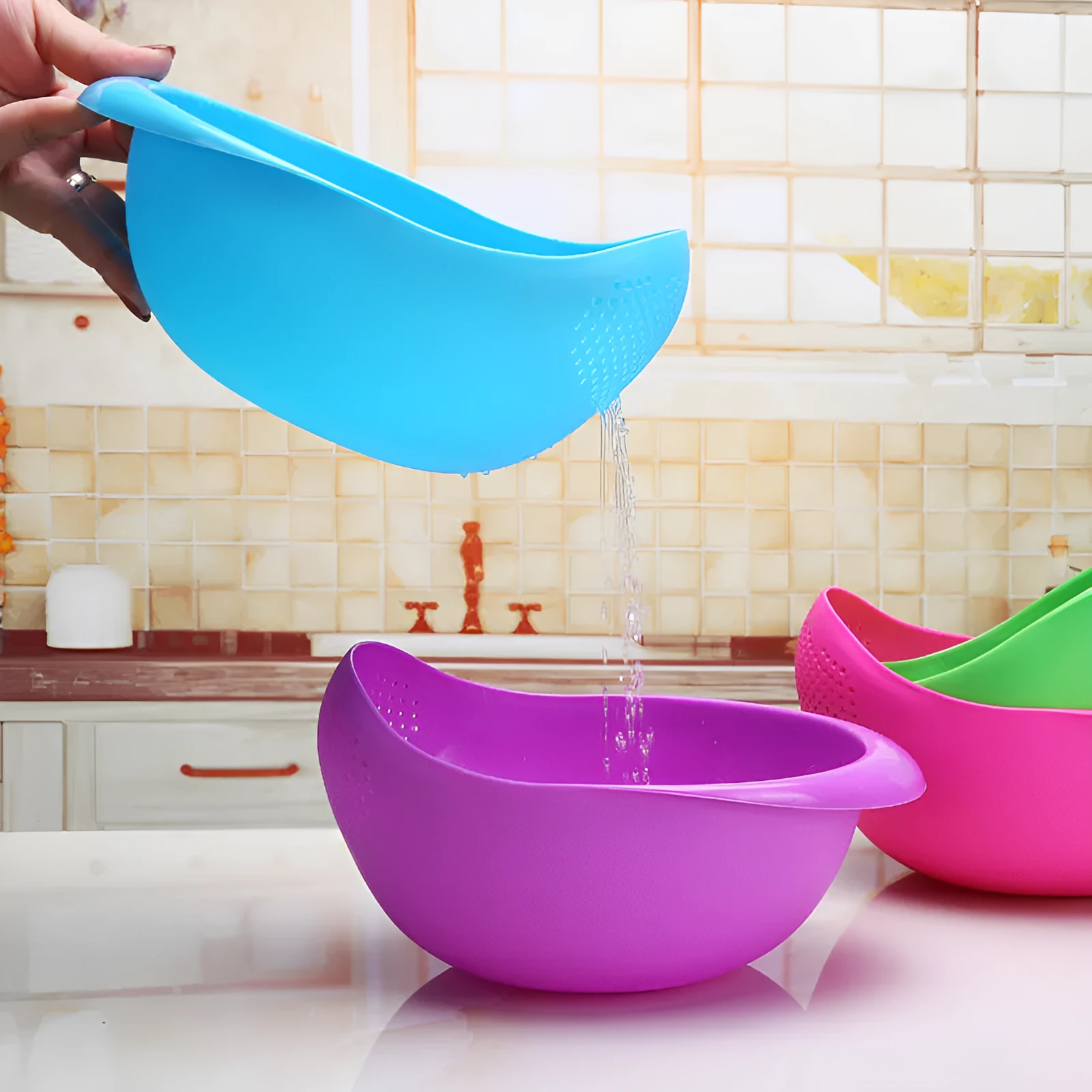 Plastic rice washing sieve in blue on a kitchen countertop with rice grains visible inside