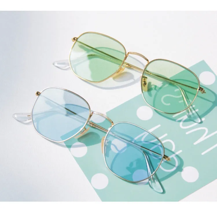 Retro street sunglasses with gold frame and transparent blue resin lenses