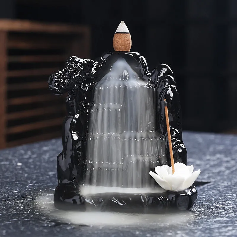 Ceramic backflow incense burner with black glaze finish and waterfall smoke effect