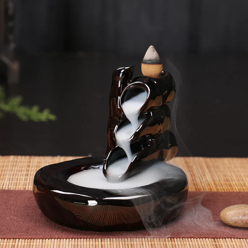 Ceramic backflow incense burner with black glaze finish and waterfall smoke effect