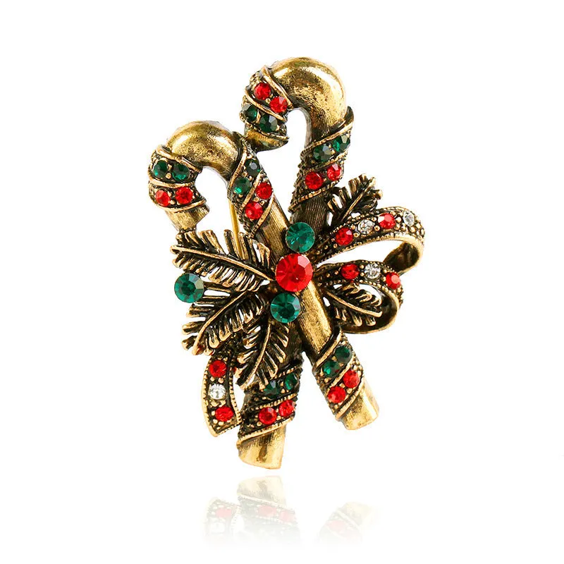 Christmas suit pin brooch in ancient gold with artificial gems, bell shape on alloy base