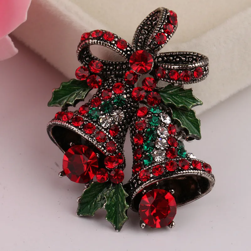 Christmas suit pin brooch in ancient gold with artificial gems, bell shape on alloy base