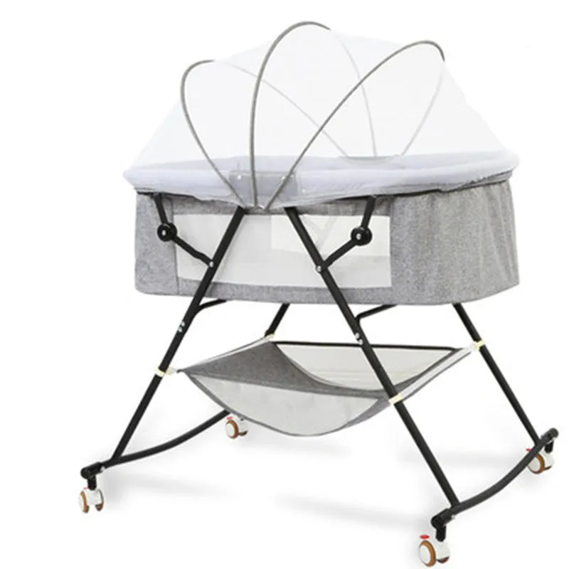 Foldable European style newborn crib with iron frame, shaker, roller, and mosquito net in a nursery setting