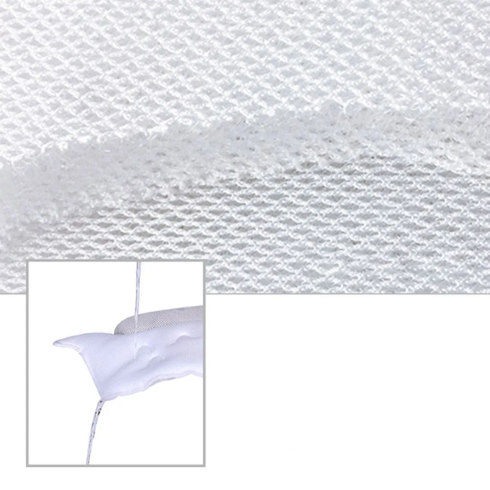 White ergonomic bathtub pillow with owl shape, 5D mesh fabric, and strong suction cups on a smooth bath surface
