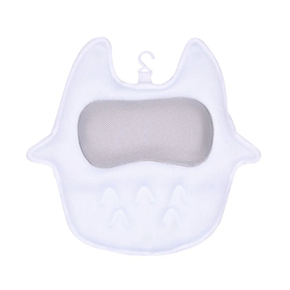 White ergonomic bathtub pillow with owl shape, 5D mesh fabric, and strong suction cups on a smooth bath surface