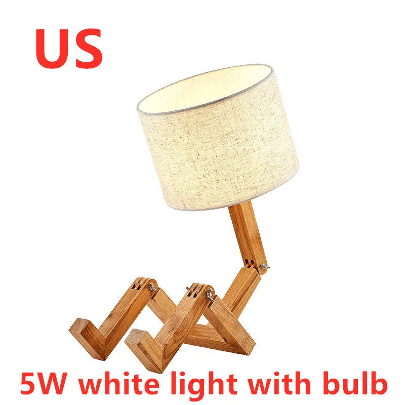 Creative small humanoid wooden table lamp with white fabric shade, 22x44x16cm, on bedside table