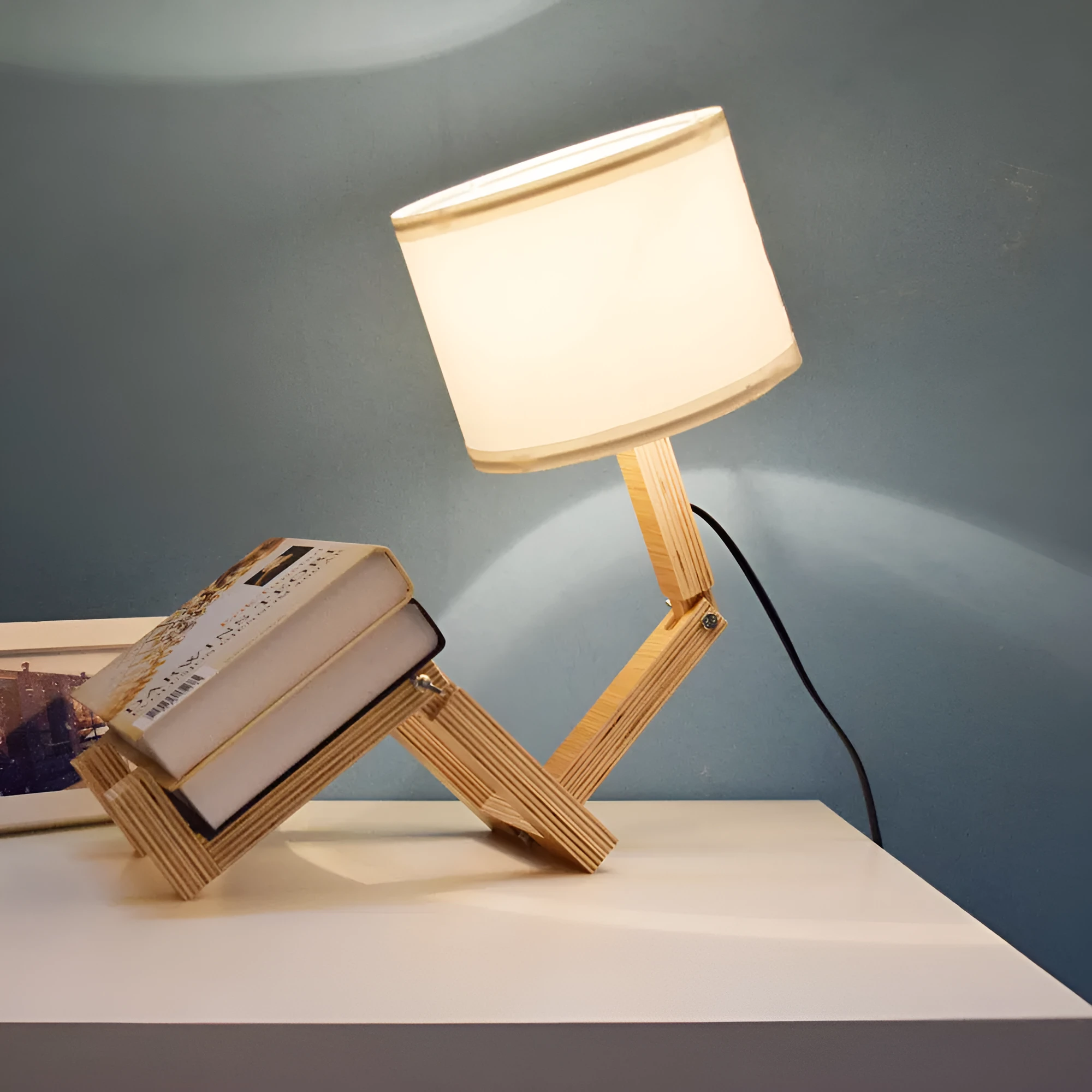 Creative small humanoid wooden table lamp with white fabric shade, 22x44x16cm, on bedside table