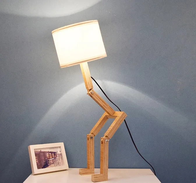 Creative small humanoid wooden table lamp with white fabric shade, 22x44x16cm, on bedside table