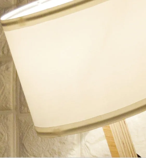 Creative small humanoid wooden table lamp with white fabric shade, 22x44x16cm, on bedside table