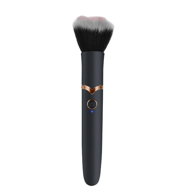 Women's beauty vibrator cosmetics brush massage toy in black with USB recharge port and one-button control