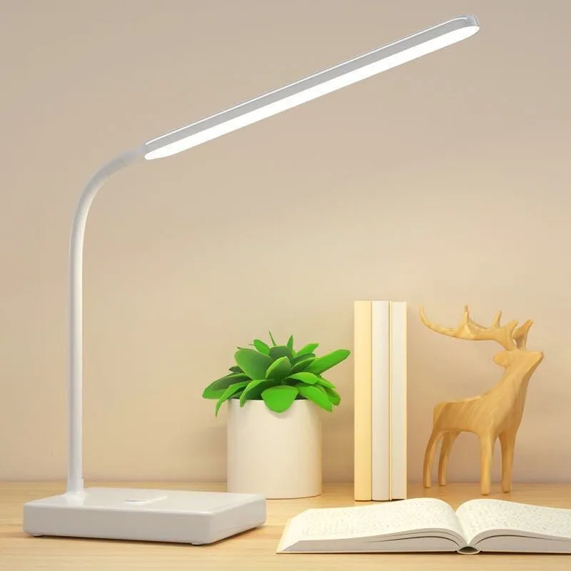 White USB charging folding LED desk lamp with touch switch and lithium battery on a desk