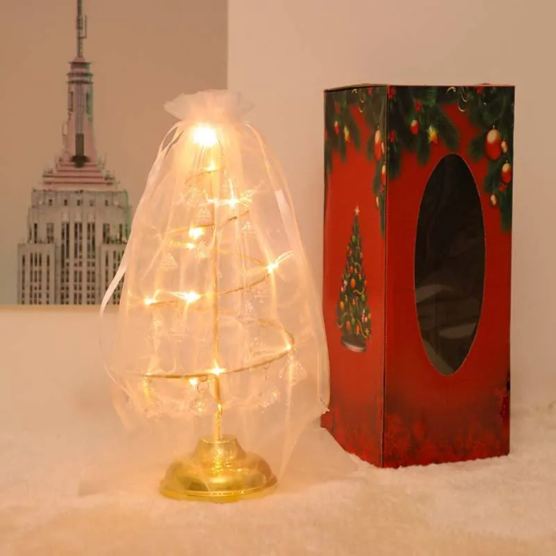 Gold crystal Christmas tree LED light with warm glow, star topper, 33cm tall, on a tabletop