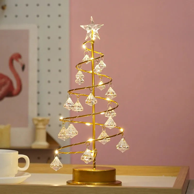 Gold crystal Christmas tree LED light with warm glow, star topper, 33cm tall, on a tabletop