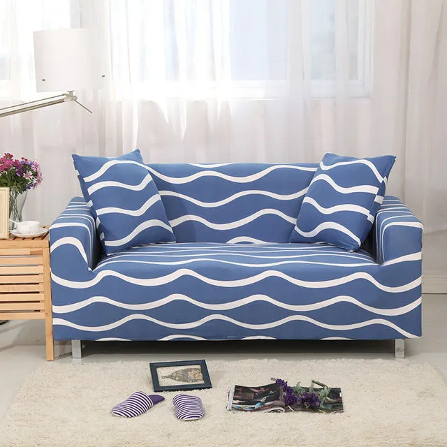 Elastic three-seat sofa cover in polyester blend fabric, stretched over a sofa, available in multiple colours A-J
