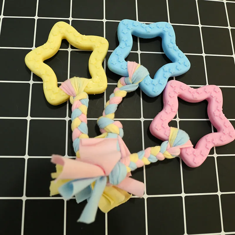 Non-toxic rubber dog chew toy in star shape with textured surface for teeth cleaning