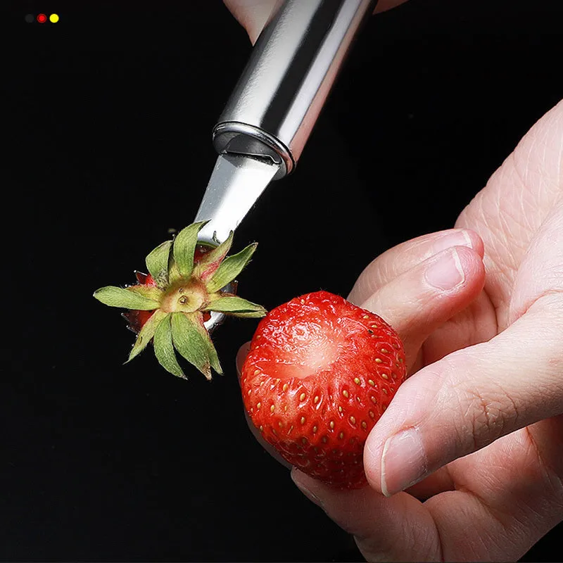 410 stainless steel strawberry stem remover on a light background, showing handheld design