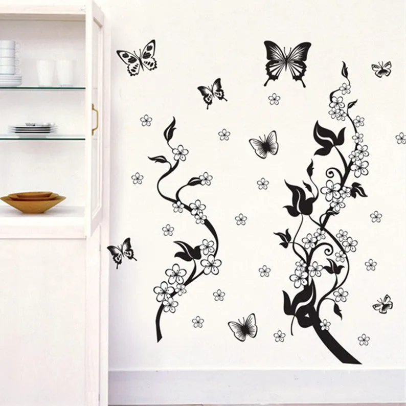 PVC wall sticker showing butterfly and flower design in photo colour on a white wall, size 50x70cm