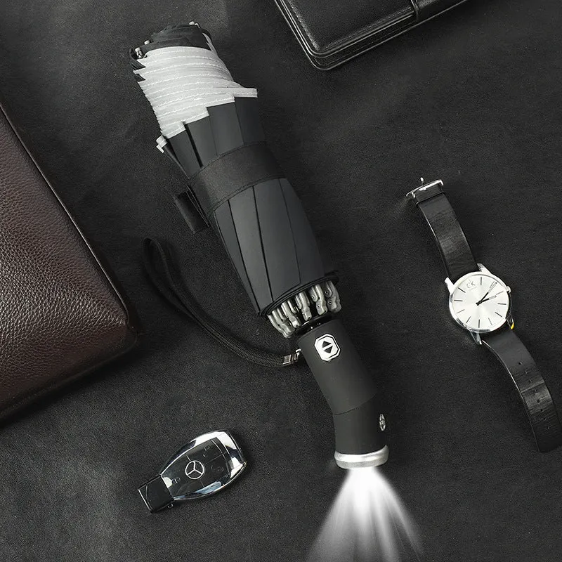 Automatic reverse umbrella with 10-bone frame in black, showing folded and open positions against a white background