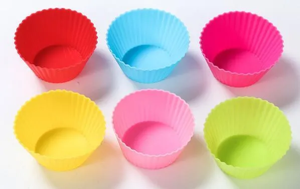 12 nonstick reusable silicone cupcake liners in six colours arranged for baking
