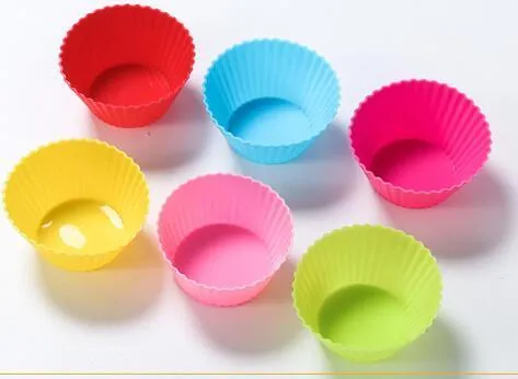 12 nonstick reusable silicone cupcake liners in six colours arranged for baking