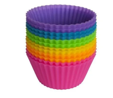 12 nonstick reusable silicone cupcake liners in six colours arranged for baking