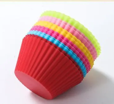 12 nonstick reusable silicone cupcake liners in six colours arranged for baking