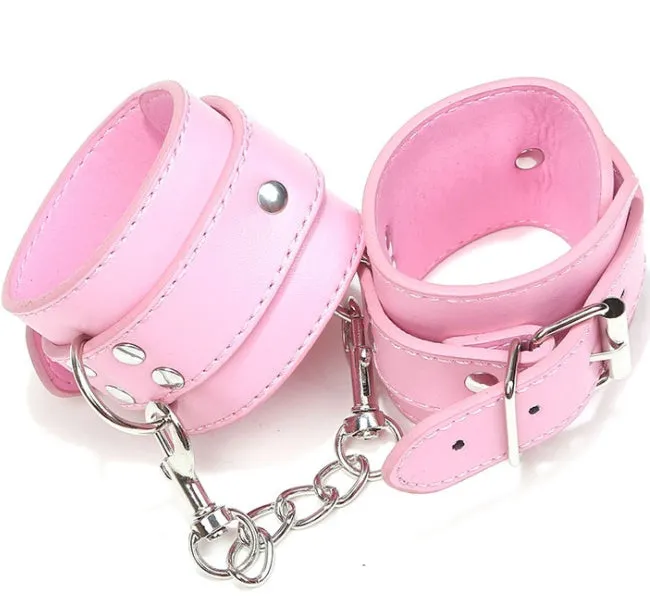 Pair of black PU leather BDSM handcuffs with adjustable metal buckle and connecting link