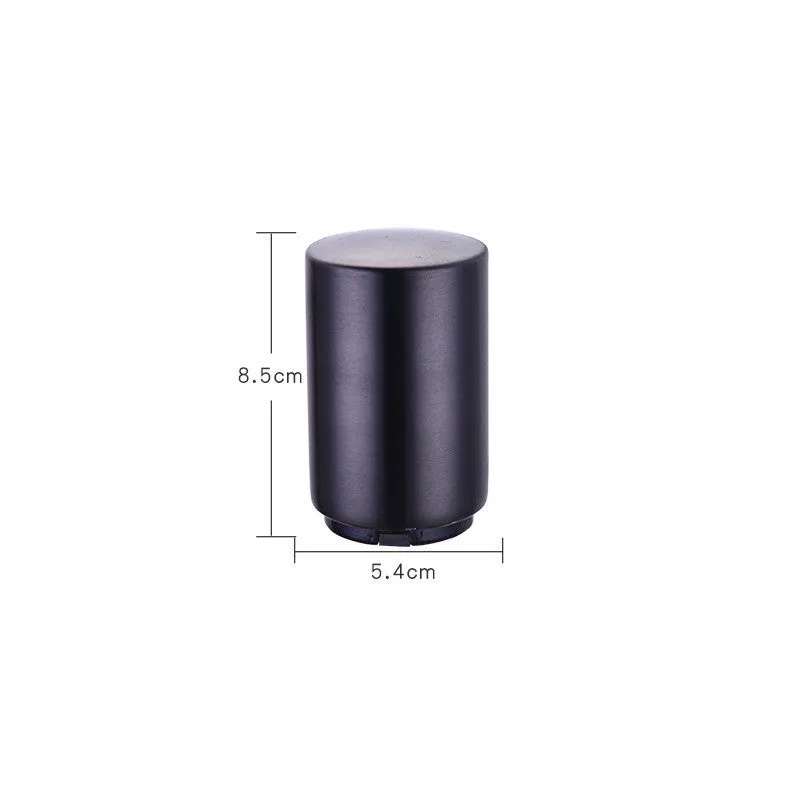 Silver magnetic automatic bottle opener with stainless steel body and brushed finish on kitchen countertop