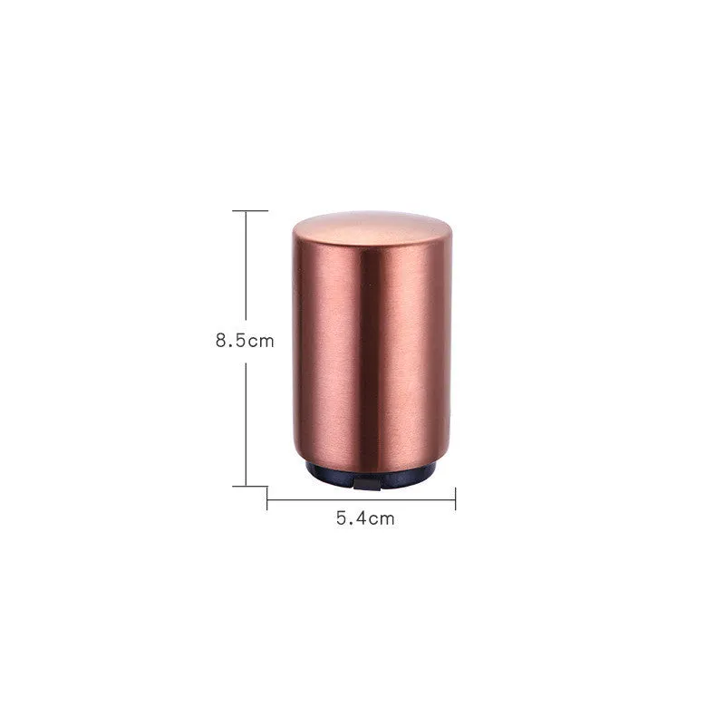 Silver magnetic automatic bottle opener with stainless steel body and brushed finish on kitchen countertop