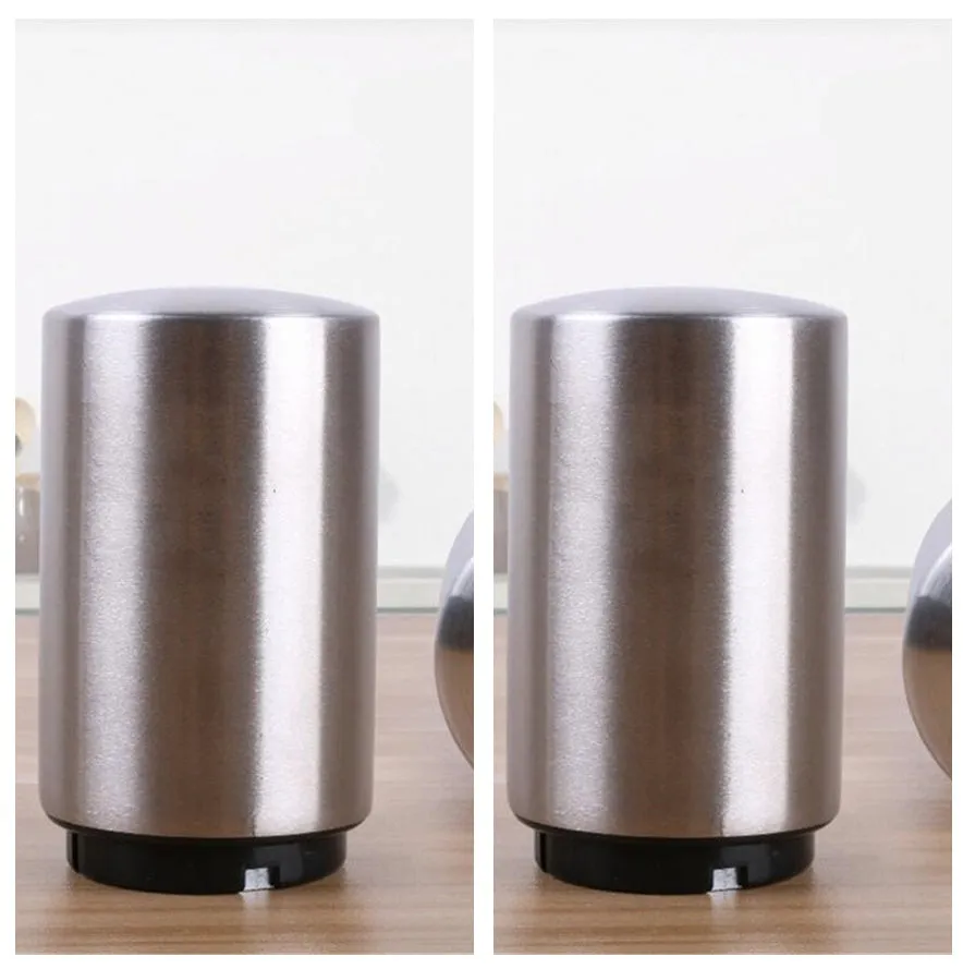 Silver magnetic automatic bottle opener with stainless steel body and brushed finish on kitchen countertop