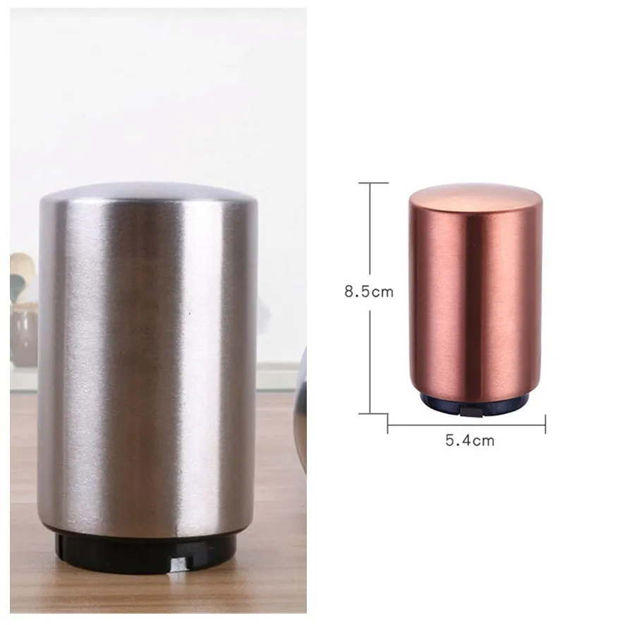 Silver magnetic automatic bottle opener with stainless steel body and brushed finish on kitchen countertop