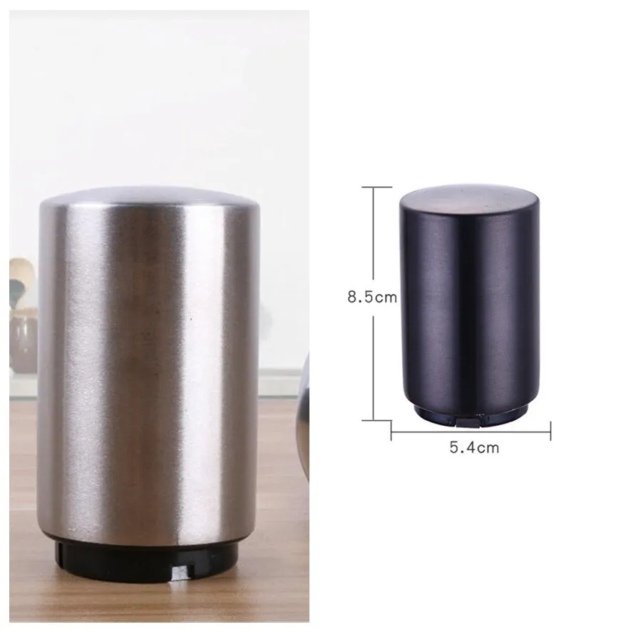 Silver magnetic automatic bottle opener with stainless steel body and brushed finish on kitchen countertop