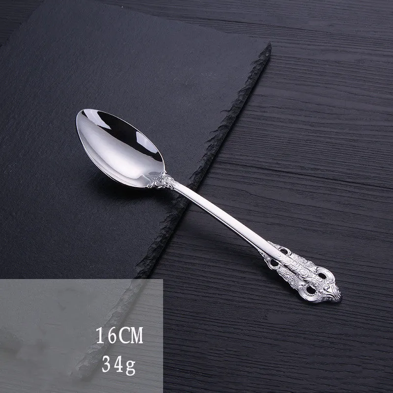 Stainless steel cutlery set with main knife, main fork, main spoon, and teaspoon in silver finish