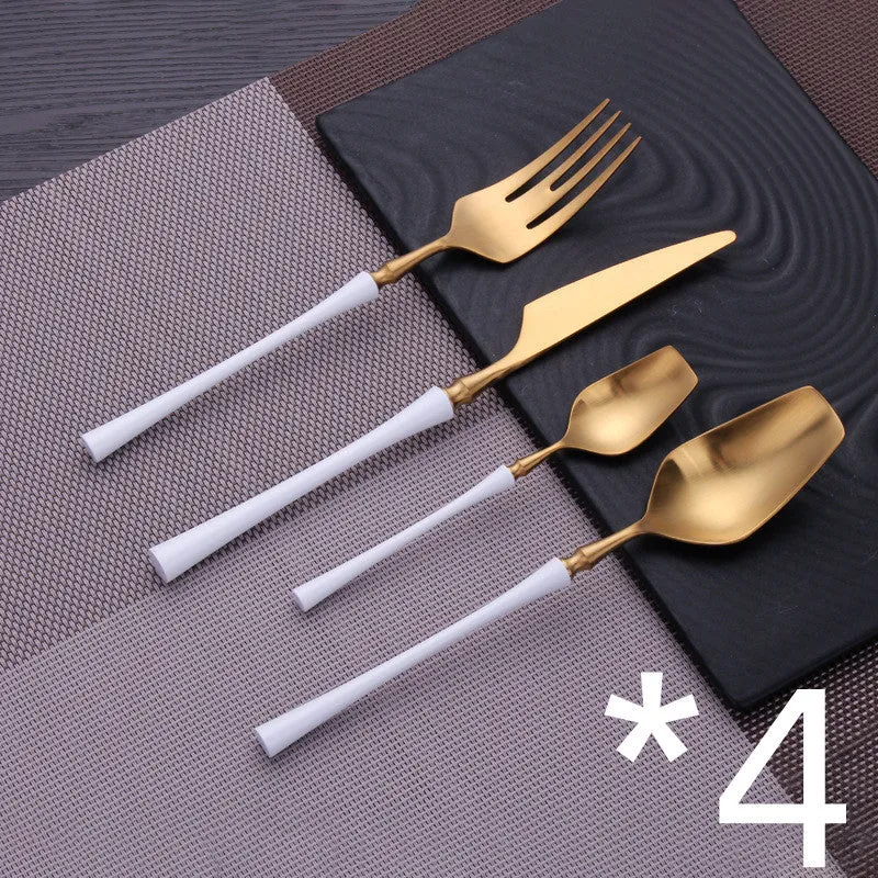 Stainless steel cutlery set with main knife, main fork, main spoon, and teaspoon in silver finish
