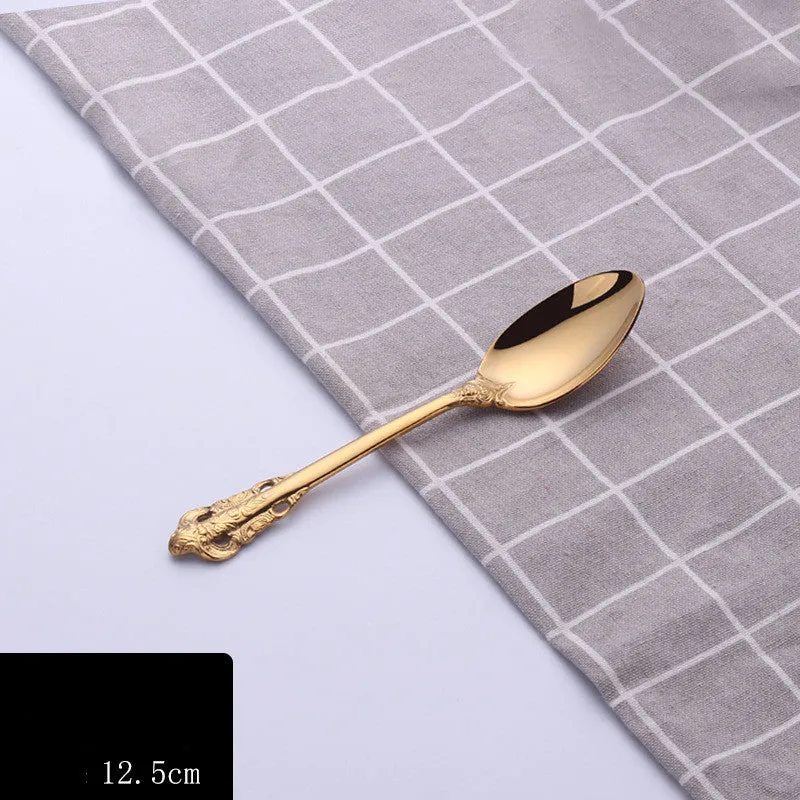 Stainless steel cutlery set with main knife, main fork, main spoon, and teaspoon in silver finish