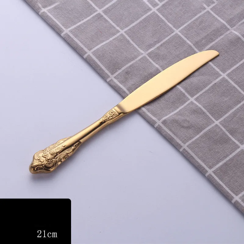 Stainless steel cutlery set with main knife, main fork, main spoon, and teaspoon in silver finish