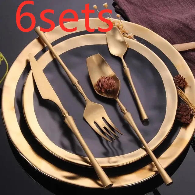 Stainless steel cutlery set with main knife, main fork, main spoon, and teaspoon in silver finish