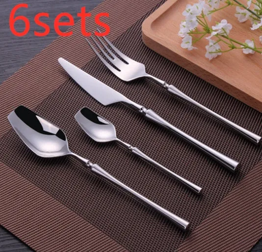 Stainless steel cutlery set with main knife, main fork, main spoon, and teaspoon in silver finish