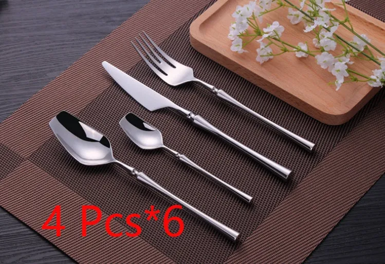 Stainless steel cutlery set with main knife, main fork, main spoon, and teaspoon in silver finish
