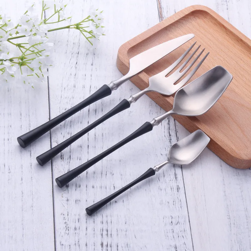 Stainless steel cutlery set with main knife, main fork, main spoon, and teaspoon in silver finish