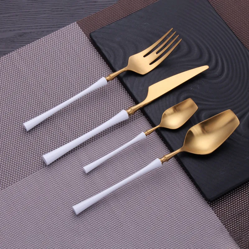 Stainless steel cutlery set with main knife, main fork, main spoon, and teaspoon in silver finish