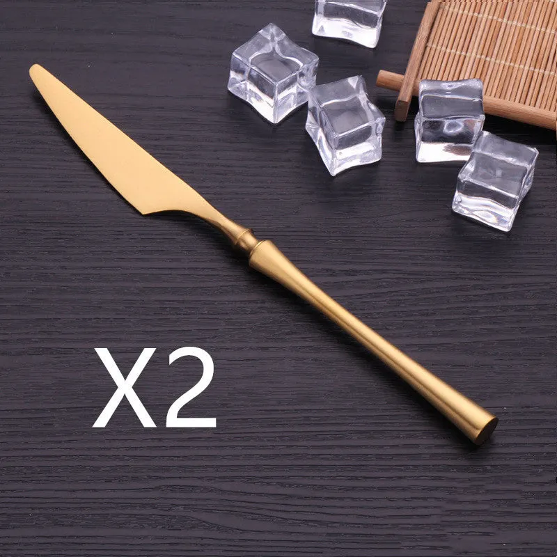 Stainless steel cutlery set with main knife, main fork, main spoon, and teaspoon in silver finish